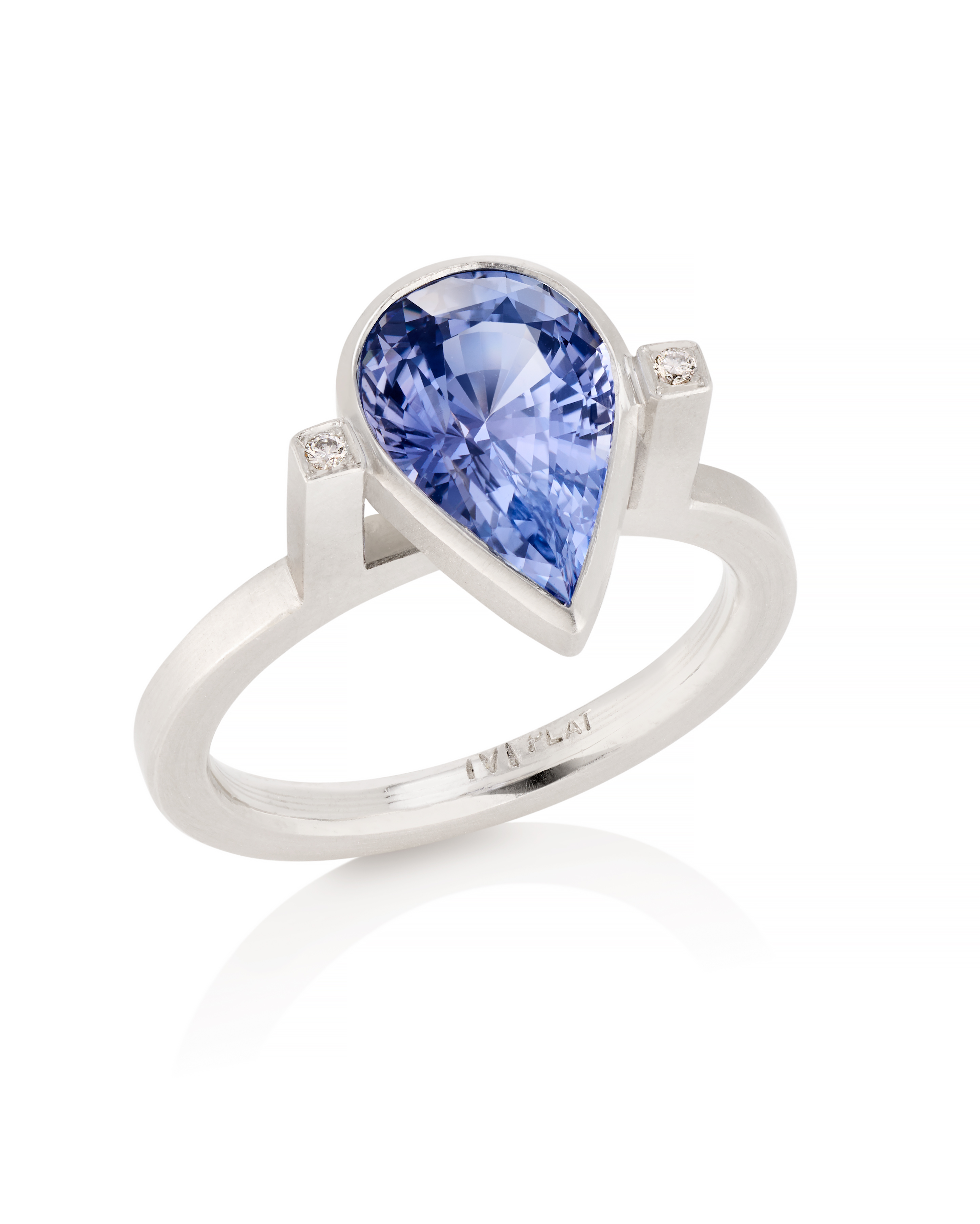 Platinum purple pear shaped sapphire and diamond ring